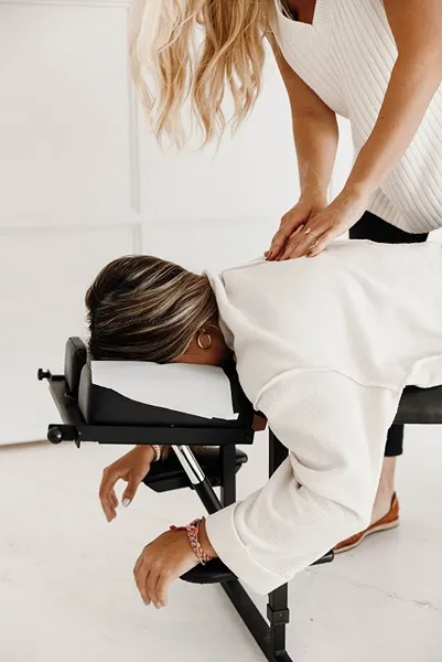 Chiropractor Coon Rapids MN Kayla Naess Adjusting Mid Back